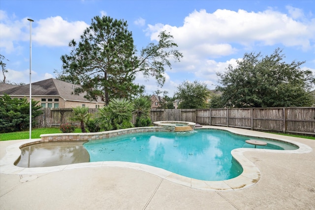 view of swimming pool with an in ground hot tub