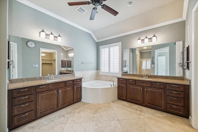 bathroom featuring tile patterned flooring, ornamental molding, vanity, and lofted ceiling