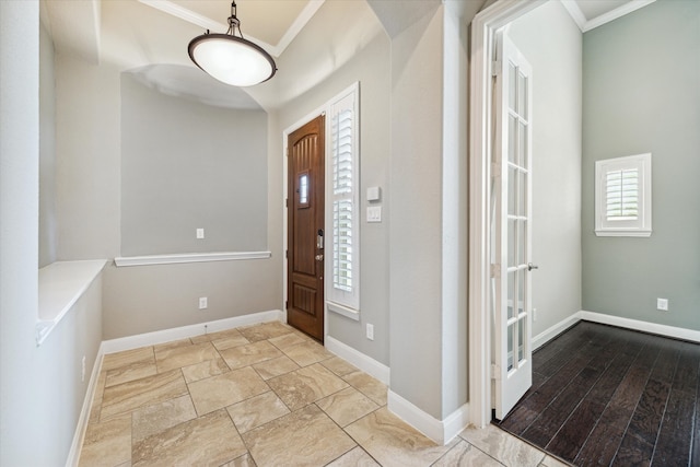 foyer entrance featuring light hardwood / wood-style flooring and crown molding