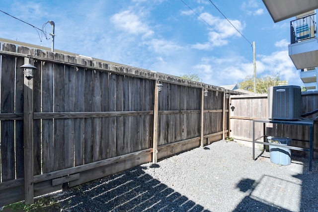 exterior space featuring cooling unit and a patio