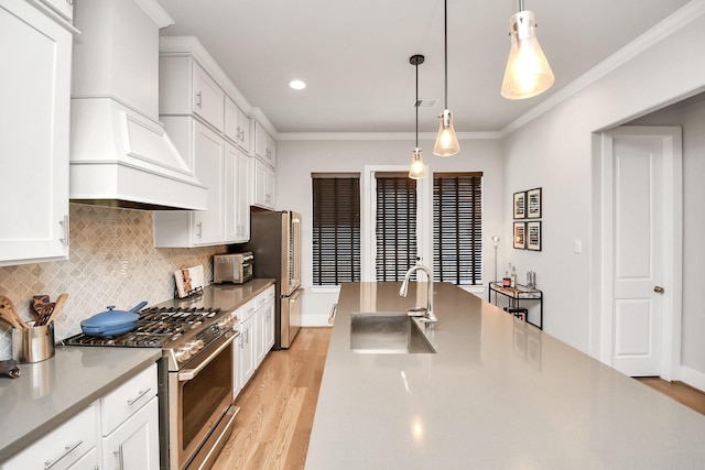 kitchen featuring white cabinets, appliances with stainless steel finishes, sink, and custom exhaust hood