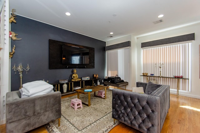 living room with light hardwood / wood-style flooring