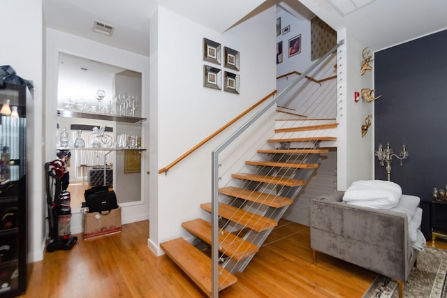 stairway with wood-type flooring