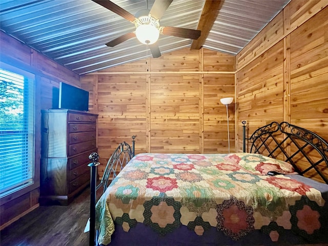 bedroom with dark hardwood / wood-style floors, ceiling fan, lofted ceiling, and wood walls