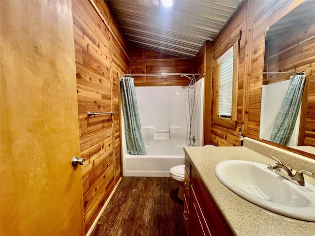 full bathroom with shower / bath combo with shower curtain, wood walls, and hardwood / wood-style floors