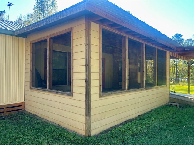 view of home's exterior featuring a sunroom