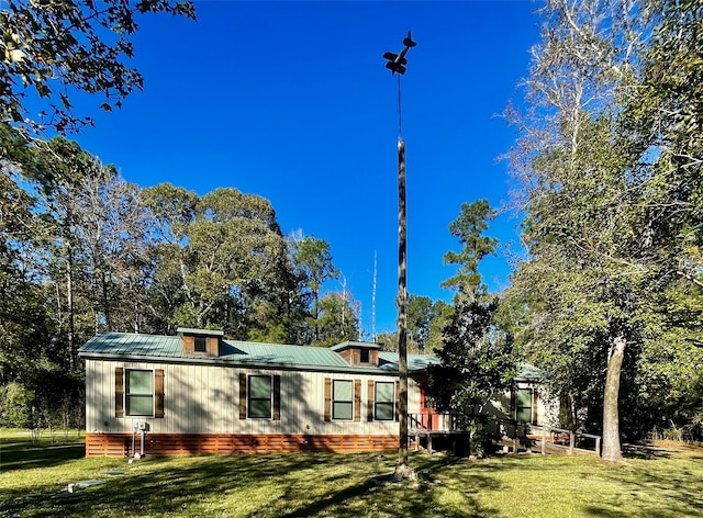 view of property exterior with a yard