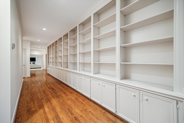 hall with hardwood / wood-style flooring