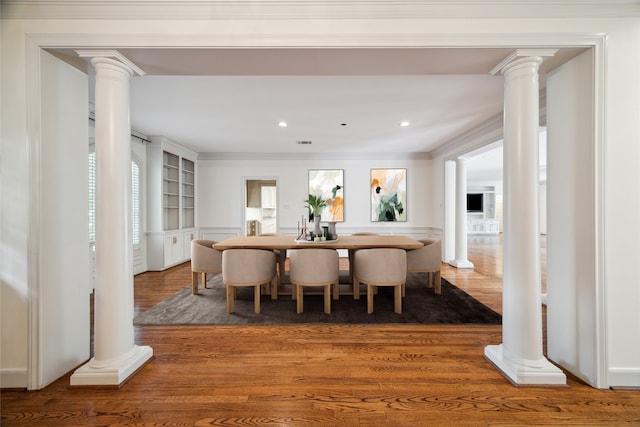 dining space with ornamental molding and dark wood-type flooring