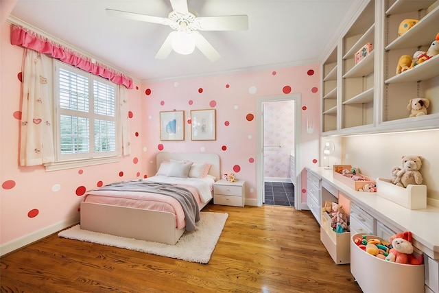 bedroom with ceiling fan, light hardwood / wood-style flooring, and crown molding