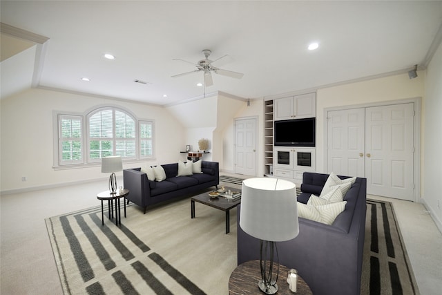 carpeted living room featuring ceiling fan, crown molding, and lofted ceiling