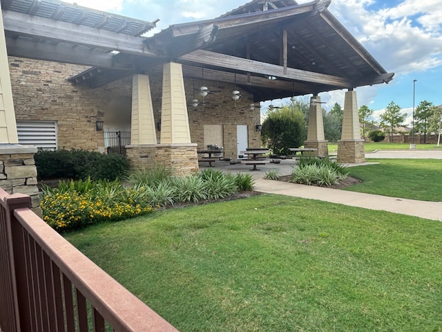 view of yard featuring ceiling fan