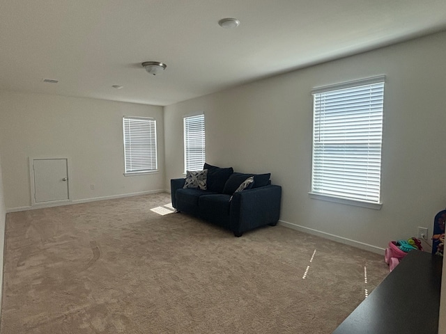 living area with light colored carpet