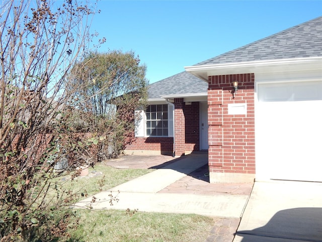 entrance to property featuring a garage