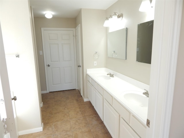 bathroom with tile patterned floors and vanity