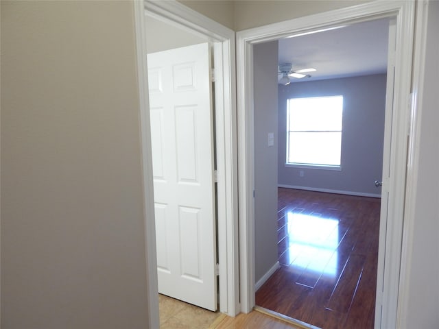 corridor with light wood-type flooring