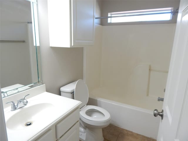 full bathroom featuring toilet, vanity, tile patterned flooring, and bathing tub / shower combination