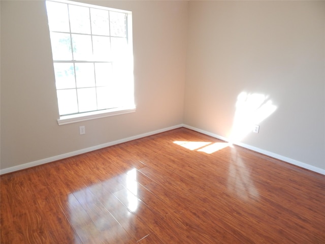 empty room with wood-type flooring