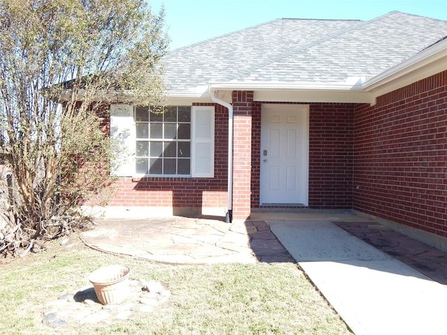 property entrance featuring a patio area