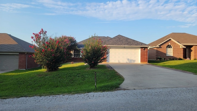 ranch-style home with a front lawn and a garage