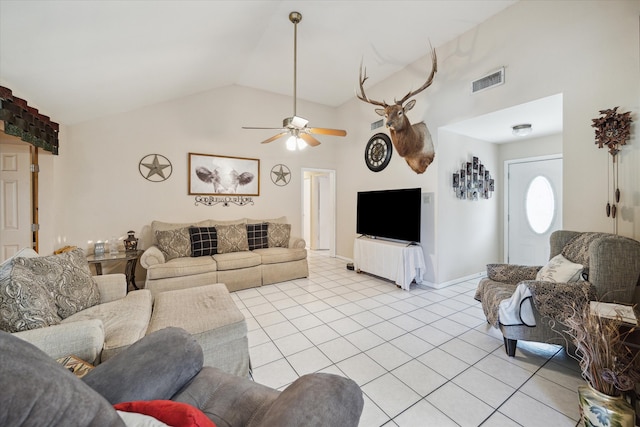 tiled living room with ceiling fan and lofted ceiling