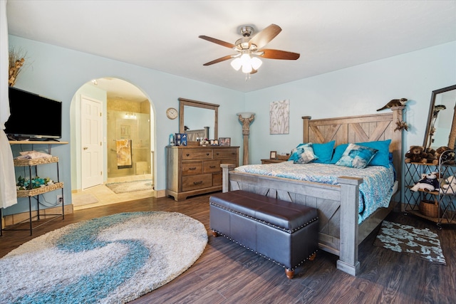 bedroom with ceiling fan, dark hardwood / wood-style flooring, and ensuite bathroom