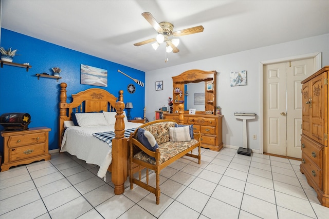 tiled bedroom featuring ceiling fan