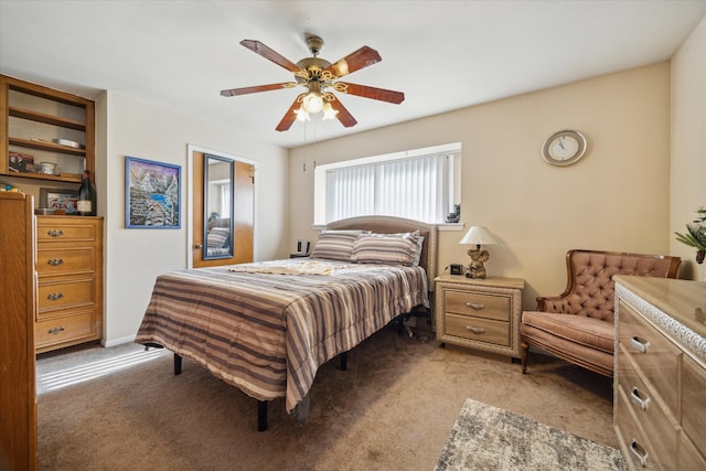 bedroom featuring light colored carpet and ceiling fan