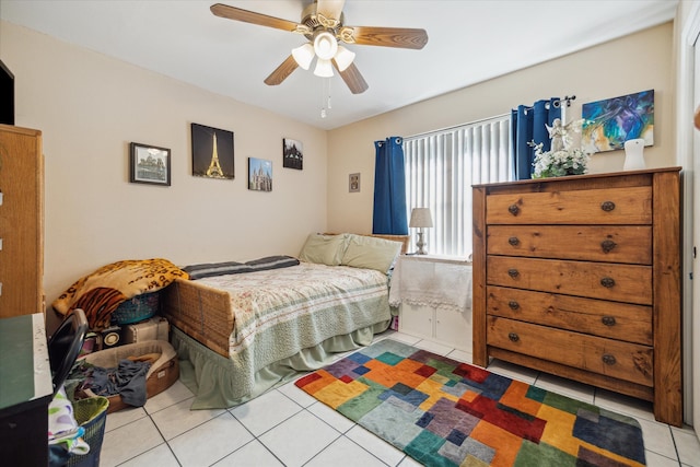 bedroom with ceiling fan and light tile patterned flooring