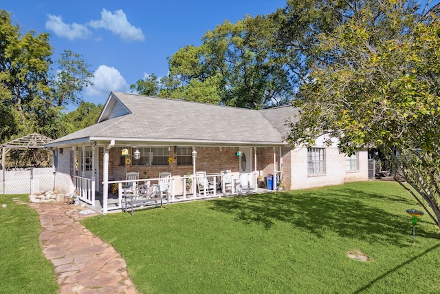 back of property featuring a lawn