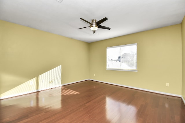 empty room with ceiling fan and wood-type flooring