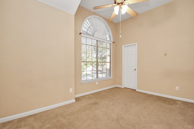 empty room with light carpet and ceiling fan