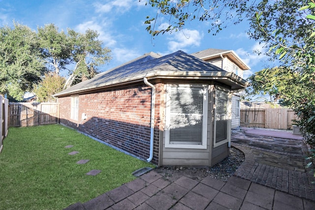 view of outdoor structure featuring a lawn