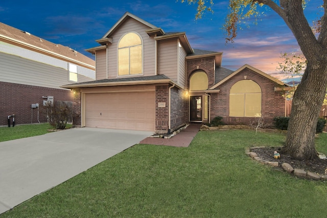 front facade with a garage and a lawn