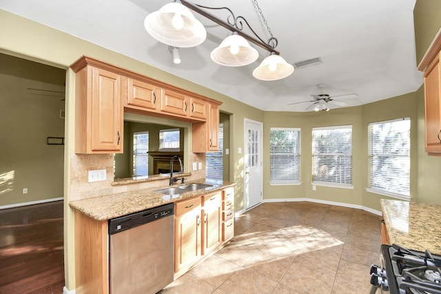 kitchen featuring sink, ceiling fan, tasteful backsplash, decorative light fixtures, and stainless steel appliances