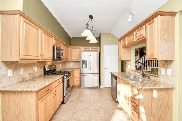 kitchen featuring hanging light fixtures, sink, vaulted ceiling, light brown cabinetry, and stainless steel appliances