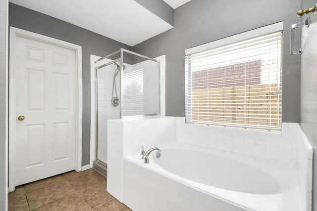 bathroom with tile patterned flooring and independent shower and bath