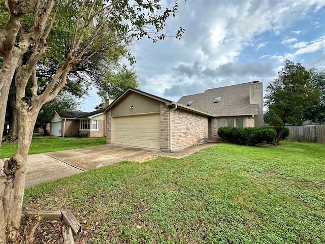 view of front facade with a garage and a front yard