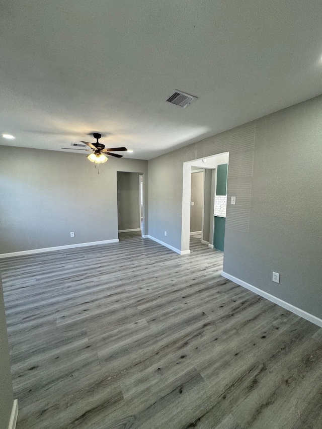 unfurnished room featuring hardwood / wood-style flooring and ceiling fan