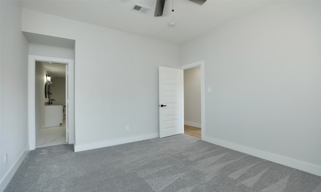 unfurnished bedroom featuring carpet flooring and ceiling fan