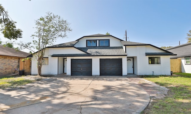 view of front of property with a garage