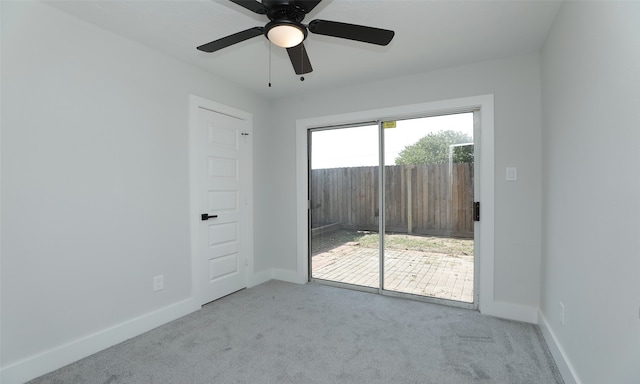 unfurnished room featuring ceiling fan and light colored carpet