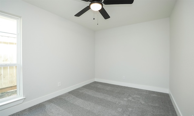 empty room with carpet floors and ceiling fan