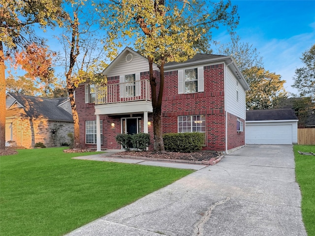 front facade featuring a balcony, a front lawn, an outdoor structure, and a garage