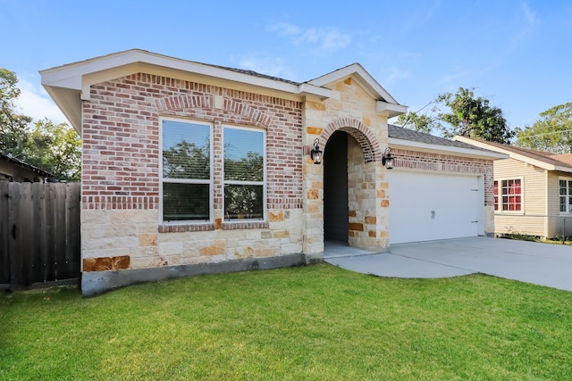 view of front of home featuring a front yard and a garage