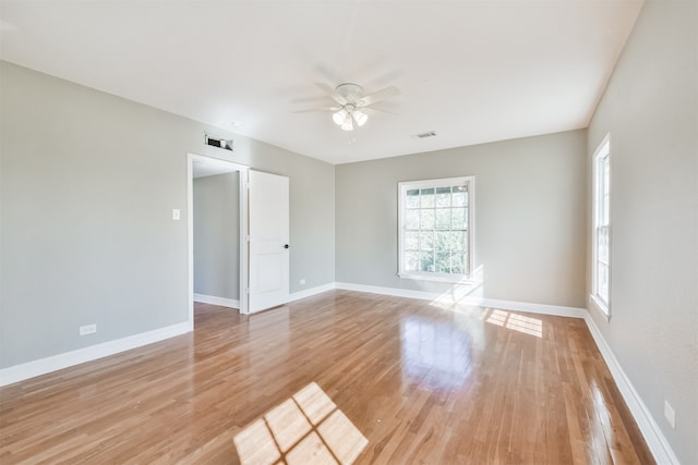 unfurnished room with ceiling fan and light wood-type flooring