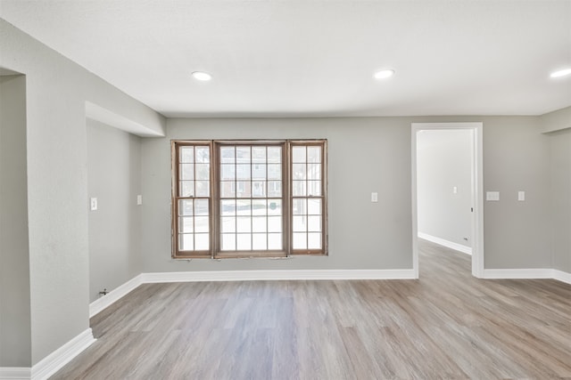 spare room featuring light hardwood / wood-style flooring