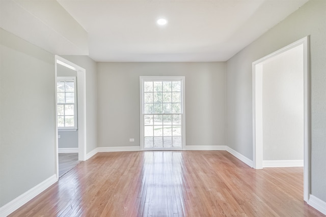 unfurnished room featuring light wood-type flooring