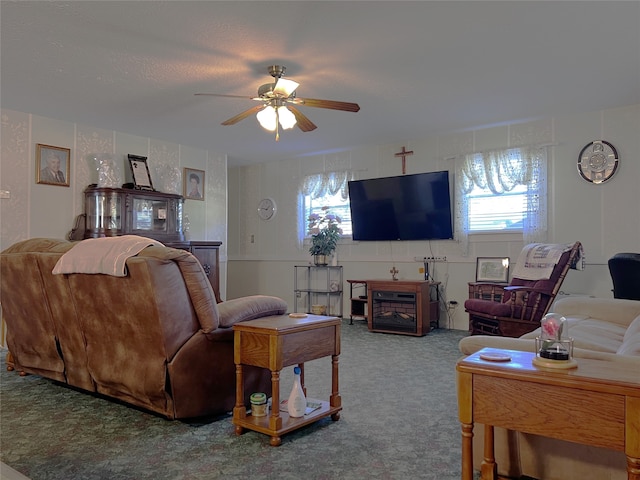 living room featuring carpet and ceiling fan