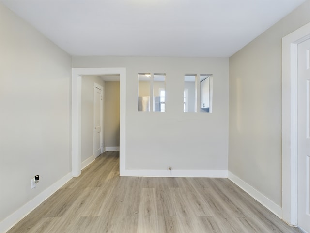 unfurnished room featuring light hardwood / wood-style flooring